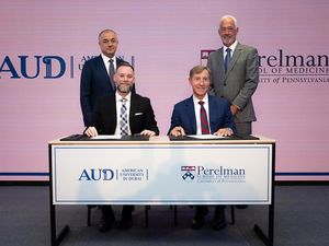 Photo of People signing an MOU